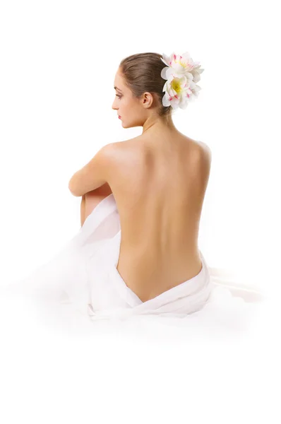 Young woman, sitting with a bare back. — Stock Photo, Image