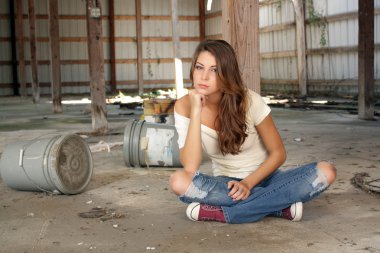 Beautiful Brunette Sitting in an Abandoned Warehouse (3) clipart