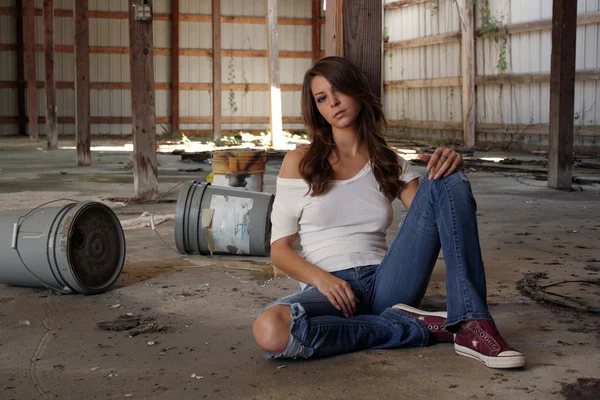 Beautiful Brunette Sitting in an Abandoned Warehouse (2) — Stock Photo, Image
