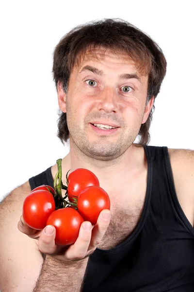 The smiling man with tomatoes on a white background — Stock Photo, Image