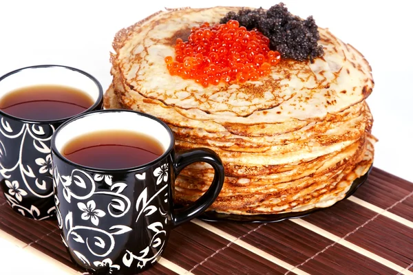Tea and a pancakes with caviar — Stock Photo, Image