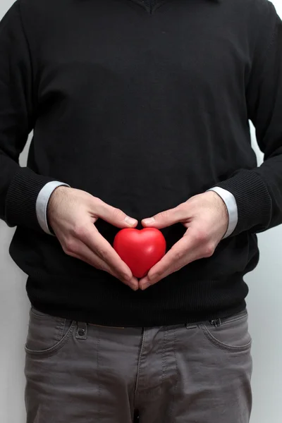 Human hand holding a heart — Stock Photo, Image