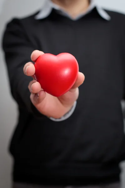 Human hand holding a heart — Stock Photo, Image