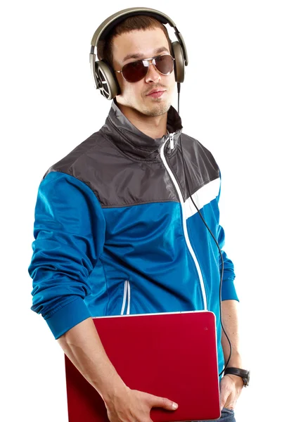 Człowiek z słuchawki i laptopa — Zdjęcie stockowe