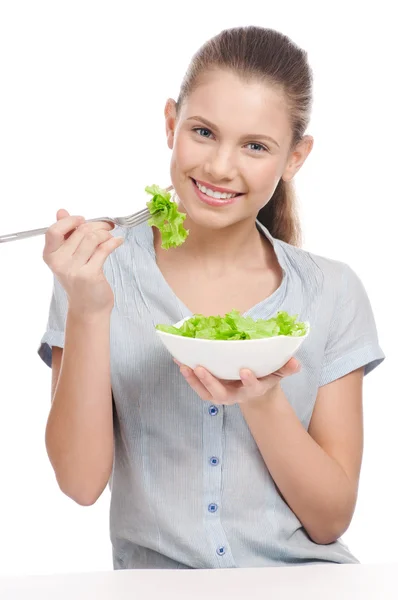 Pretty young woman eating lettuce salad. Isolated — Stock Photo, Image