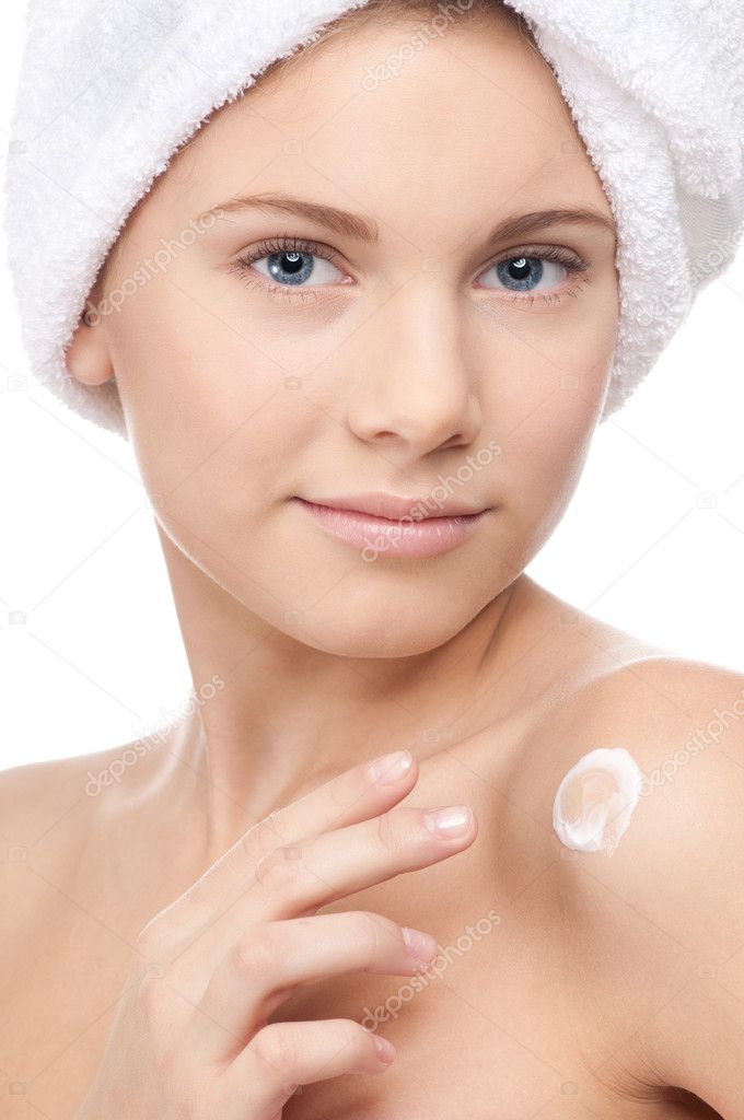 Young beautiful girl applying cream
