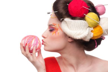 Closeup fashion woman with color face art in knitting style clipart