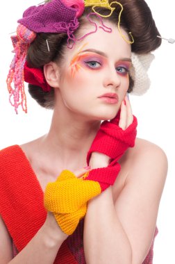 Closeup fashion woman with color face art in knitting style clipart