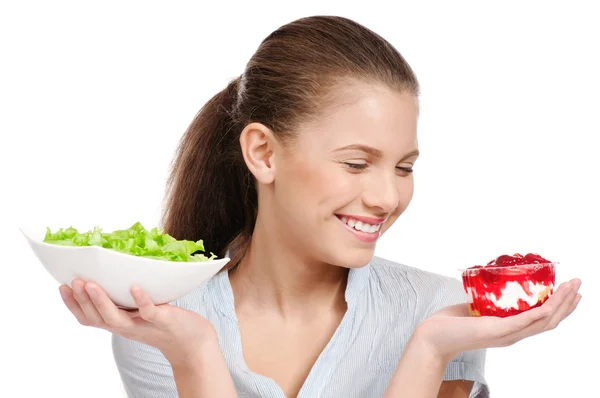Jolie salade de choix jeune femme ou gâteau. Isolé — Photo