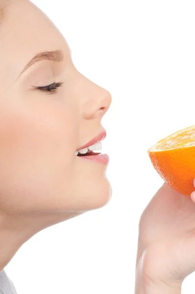 Pretty young woman with half orange — Stock Photo, Image