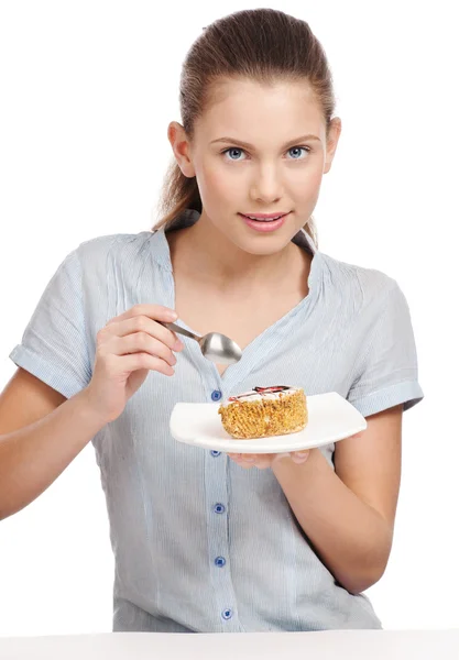 Ganska ung kvinna äta kakan. isolerade — Stockfoto
