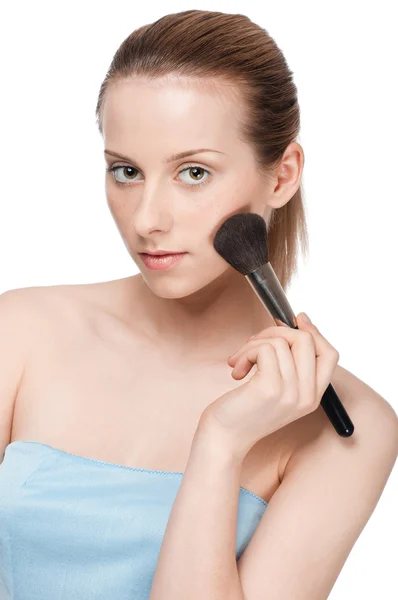 stock image Beautiful young adult woman applying cosmetic brush