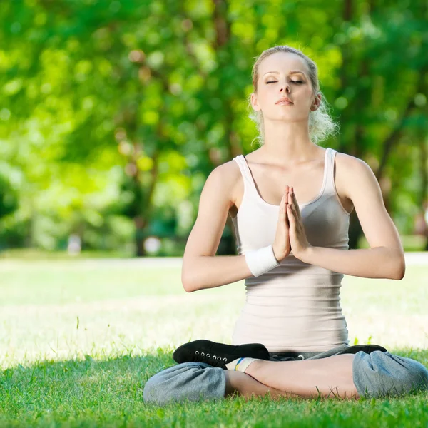 Young woman doing yoga exercise — Stock Photo, Image