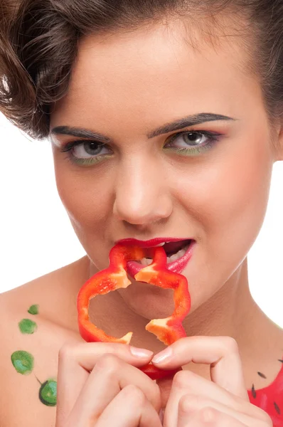 Close up portrait of young emotional woman with red pepper — Stock Photo, Image