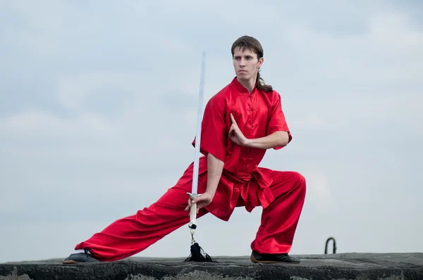 Wushoo man in red practice martial art — Stock Photo, Image