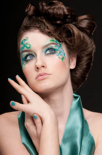 Close-up portrait of sprite girl with faceart — Stock Photo, Image