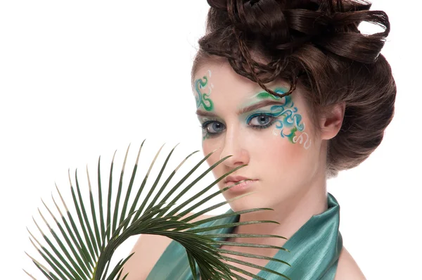 Close-up of sprite girl with faceart and plant — Stock Photo, Image