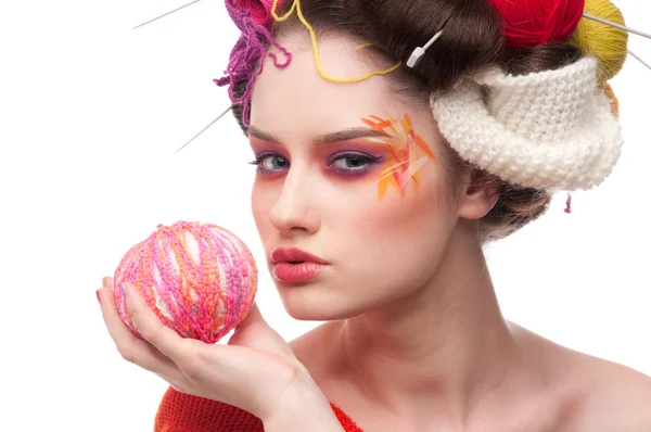 stock image Closeup fashion woman with color face art in knitting style