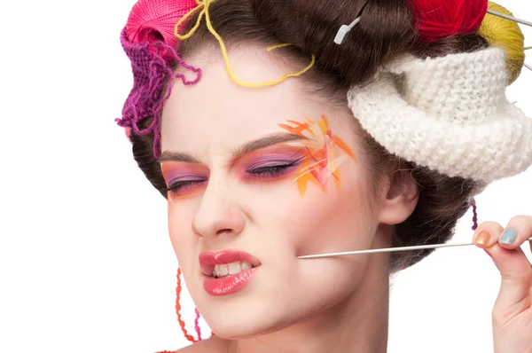 stock image Closeup fashion woman with color face art in knitting style