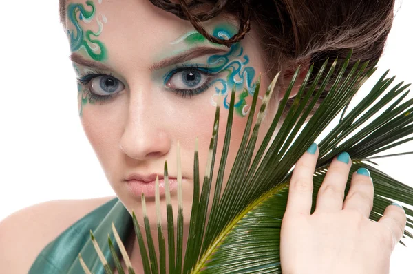 Close-up of sprite girl with faceart and plant — Stock Photo, Image