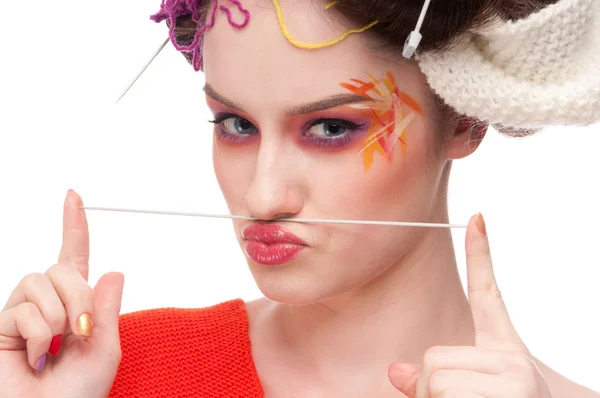Closeup fashion woman with color face art in knitting style — Stock Photo, Image