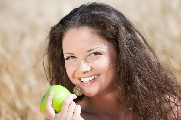 stock image Perfect woman eating apple in dield. Summer picnic.