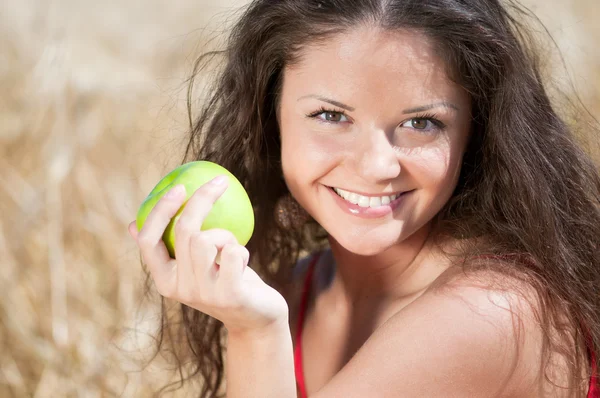 stock image Perfect woman eating apple in dield. Summer picnic.