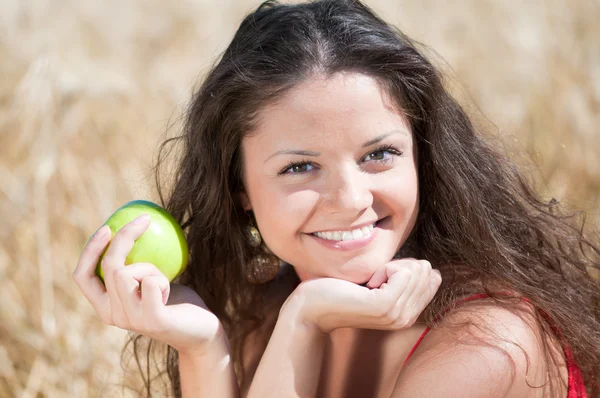 stock image Perfect woman eating apple in dield. Summer picnic.