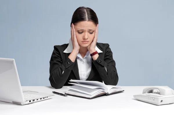 Sad business woman with personal organizer. Stock Picture