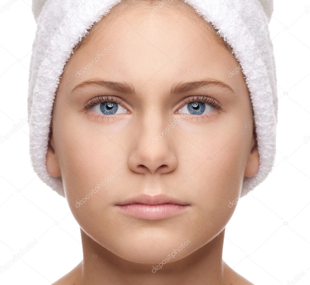 Full symmetrical face of girl with towel