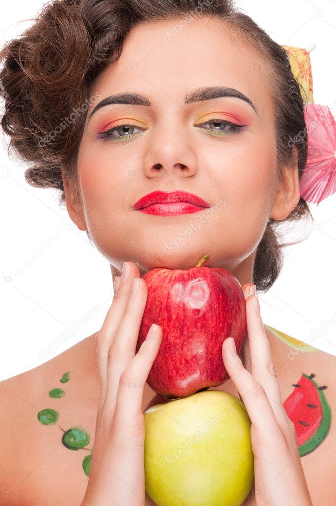 Close up portrait of young emotional woman with apple