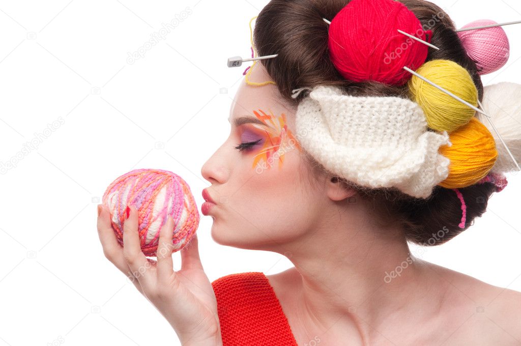 Closeup fashion woman with color face art in knitting style