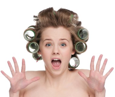 Woman curling her hair with roller clipart