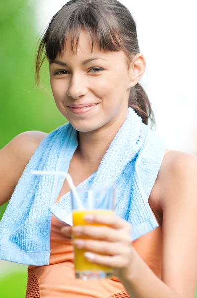 Girl drinking juice after exercise — Stock Photo, Image