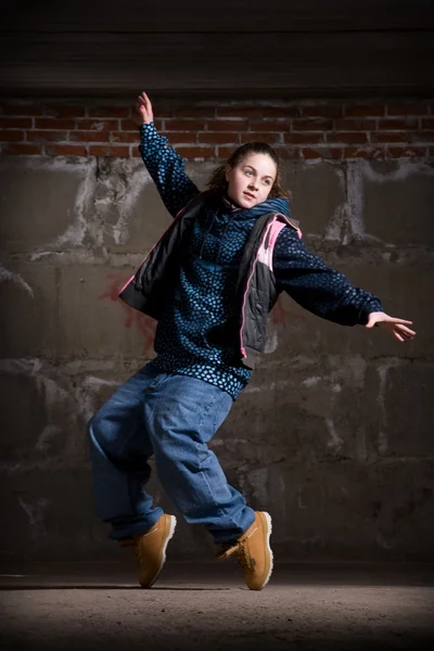 stock image Hip hop dancer in modern style over brick wall