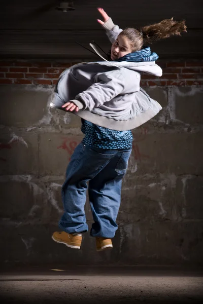 stock image Hip hop dancer in modern style over brick wall