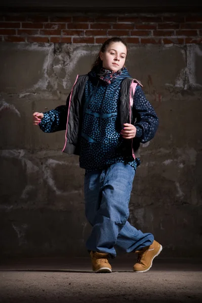 stock image Hip hop dancer in modern style over brick wall