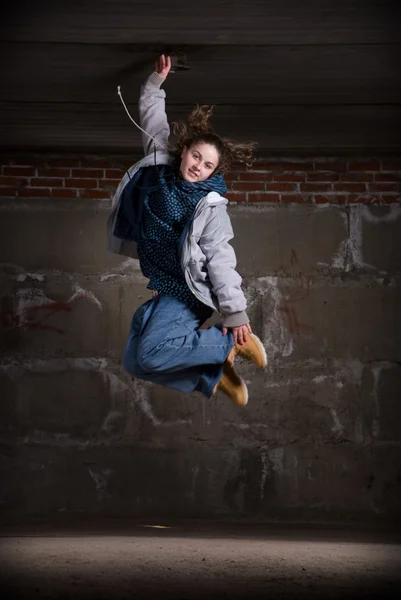 Hip hop dancer in modern style over brick wall — Stock Photo, Image