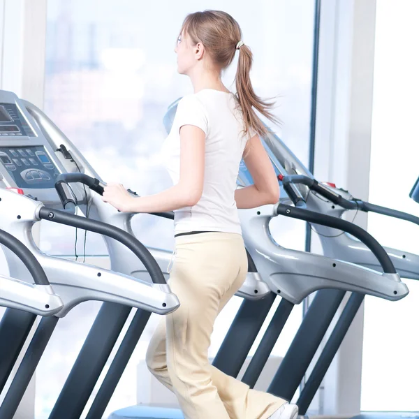 Young woman at the gym exercising. Running — Stock Photo, Image
