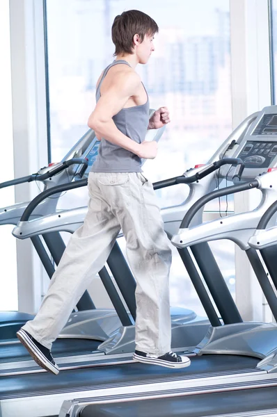 Young man at the gym exercising. Running — Stock Photo, Image