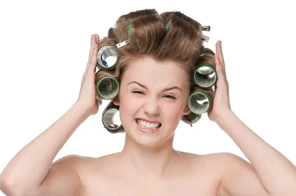 Woman curling her hair with roller — Stock Photo, Image
