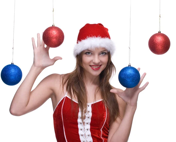 Žena v santa šaty a vánoční koule — Stock fotografie