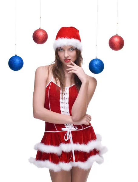Mujer en vestido de santa y bolas de Navidad —  Fotos de Stock