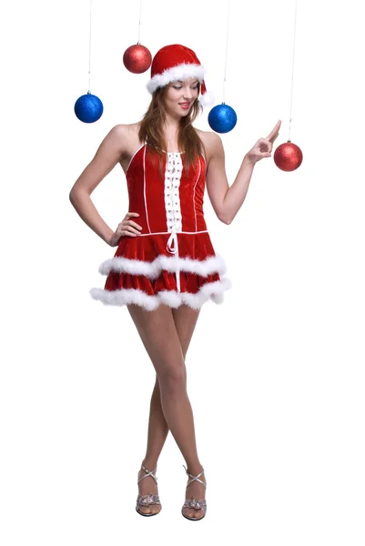 Porträt eines Mädchens im Weihnachtsmannkleid, das mit Bällen spielt — Stockfoto