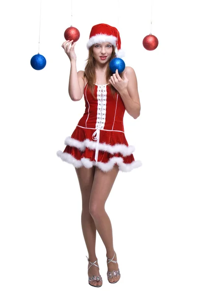 Portrait de fille en robe de Père Noël jouant avec des boules — Photo
