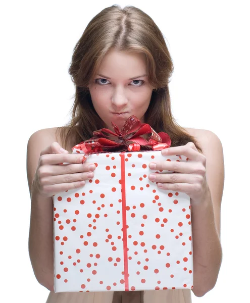 Closeup portrait of angry woman with big gift — Stock Photo, Image