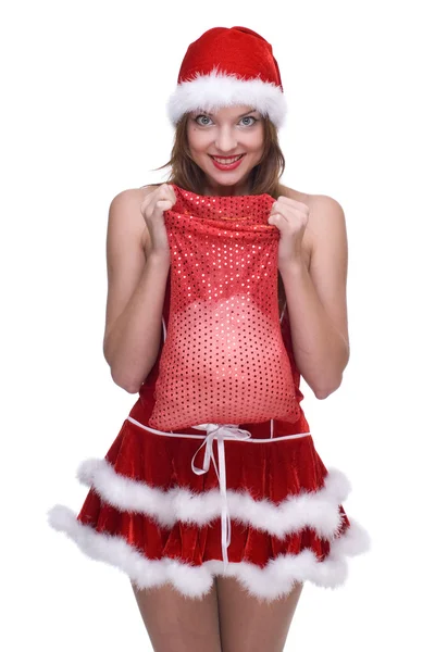 Kobieta w sukni i prezenty torba na santa klauzuli — Zdjęcie stockowe