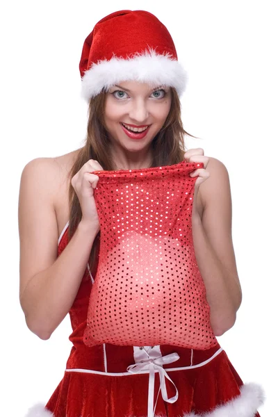 Zbliżenie dziewczyna w santa klauzuli sukienka i prezenty torba — Zdjęcie stockowe