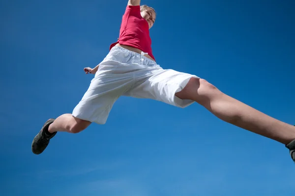 Beautiful woman jump into sky — Stock Photo, Image