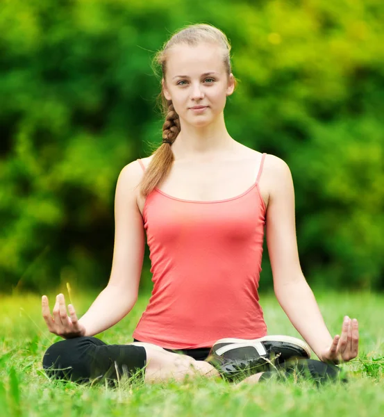 Young woman doing stretching exercise Stock Picture